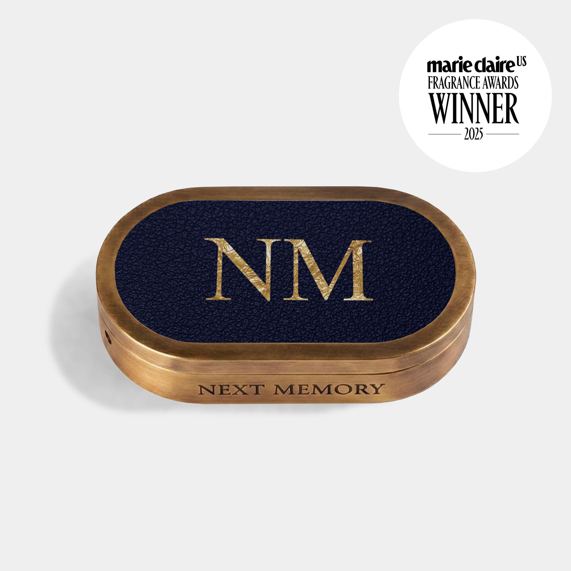 closed solid perfume in an aged brass case