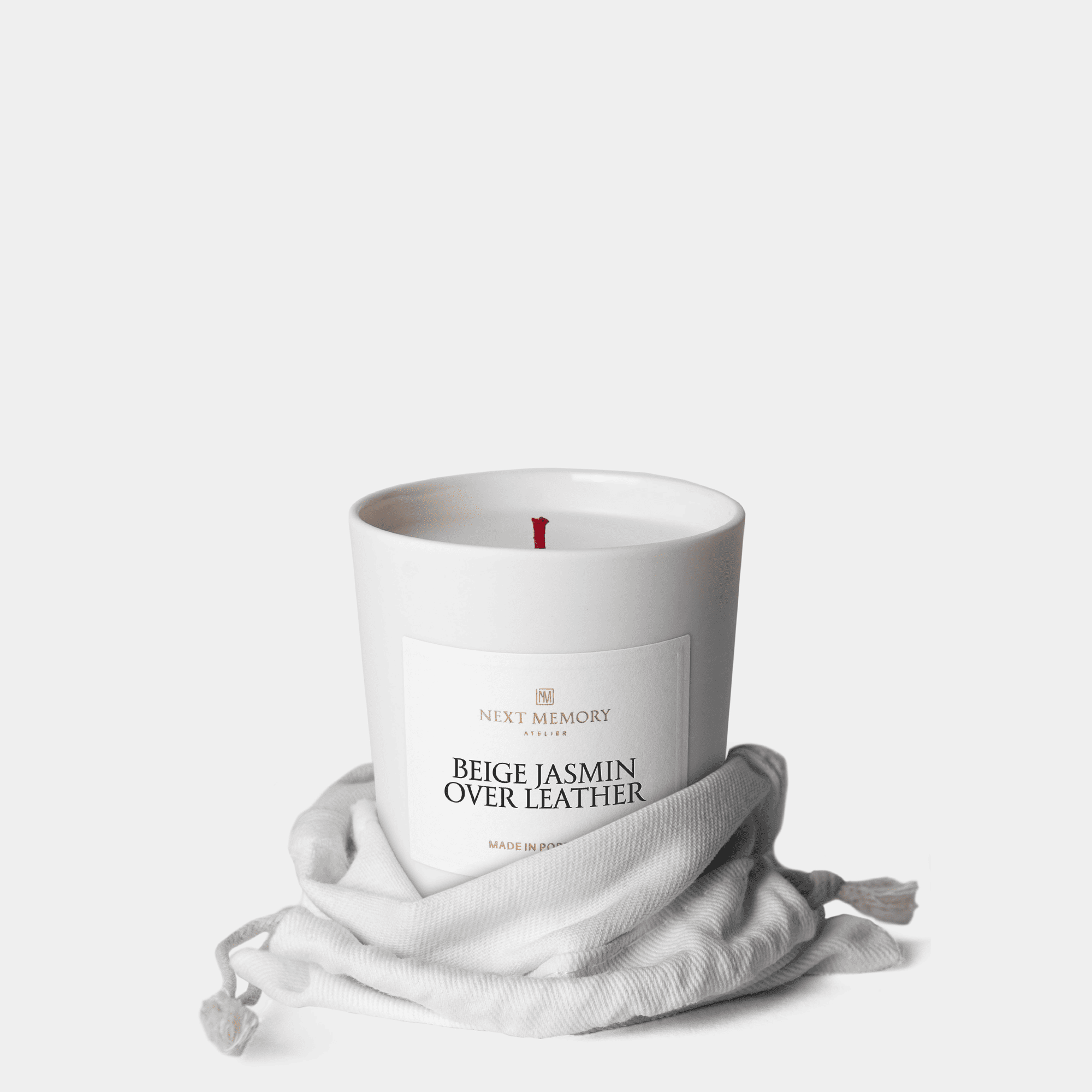 beige jasmin over leather small scented candle in a bag