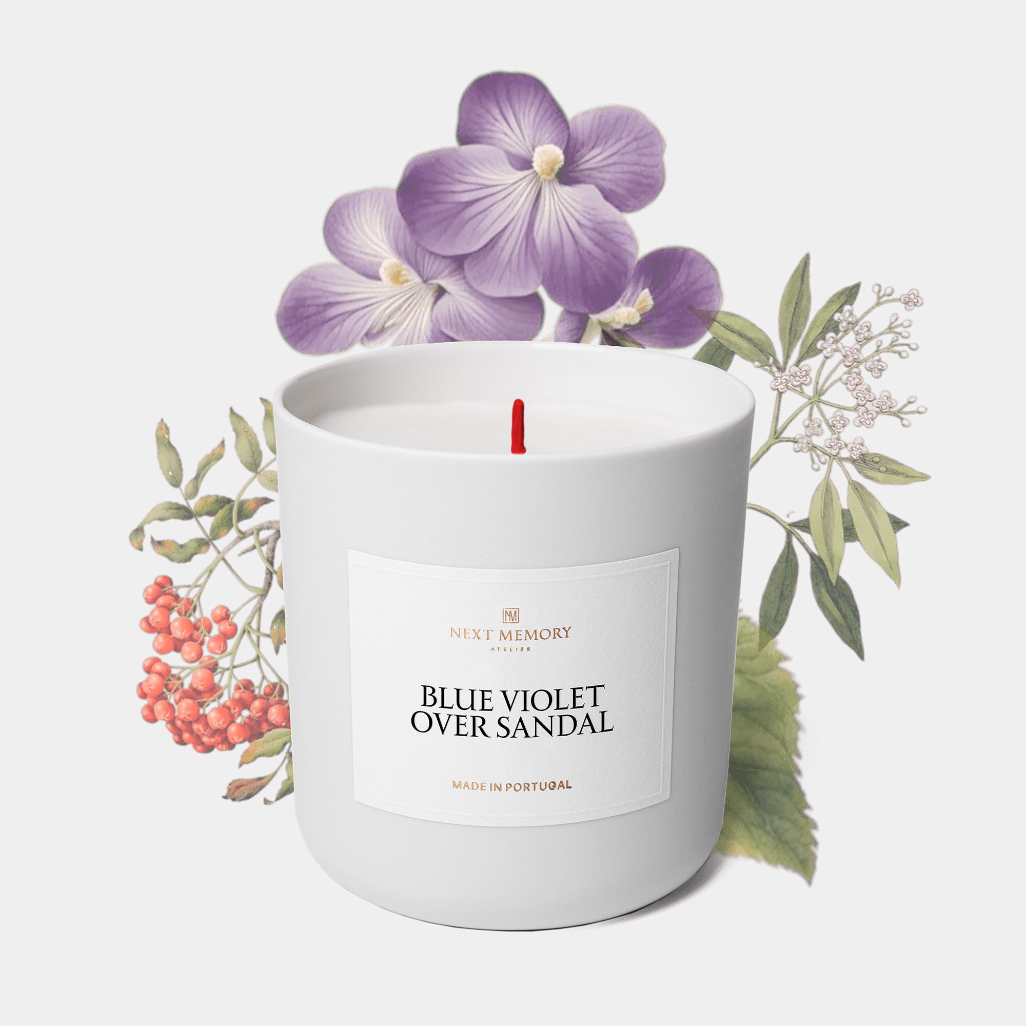 blue violet candle with fflowers in background