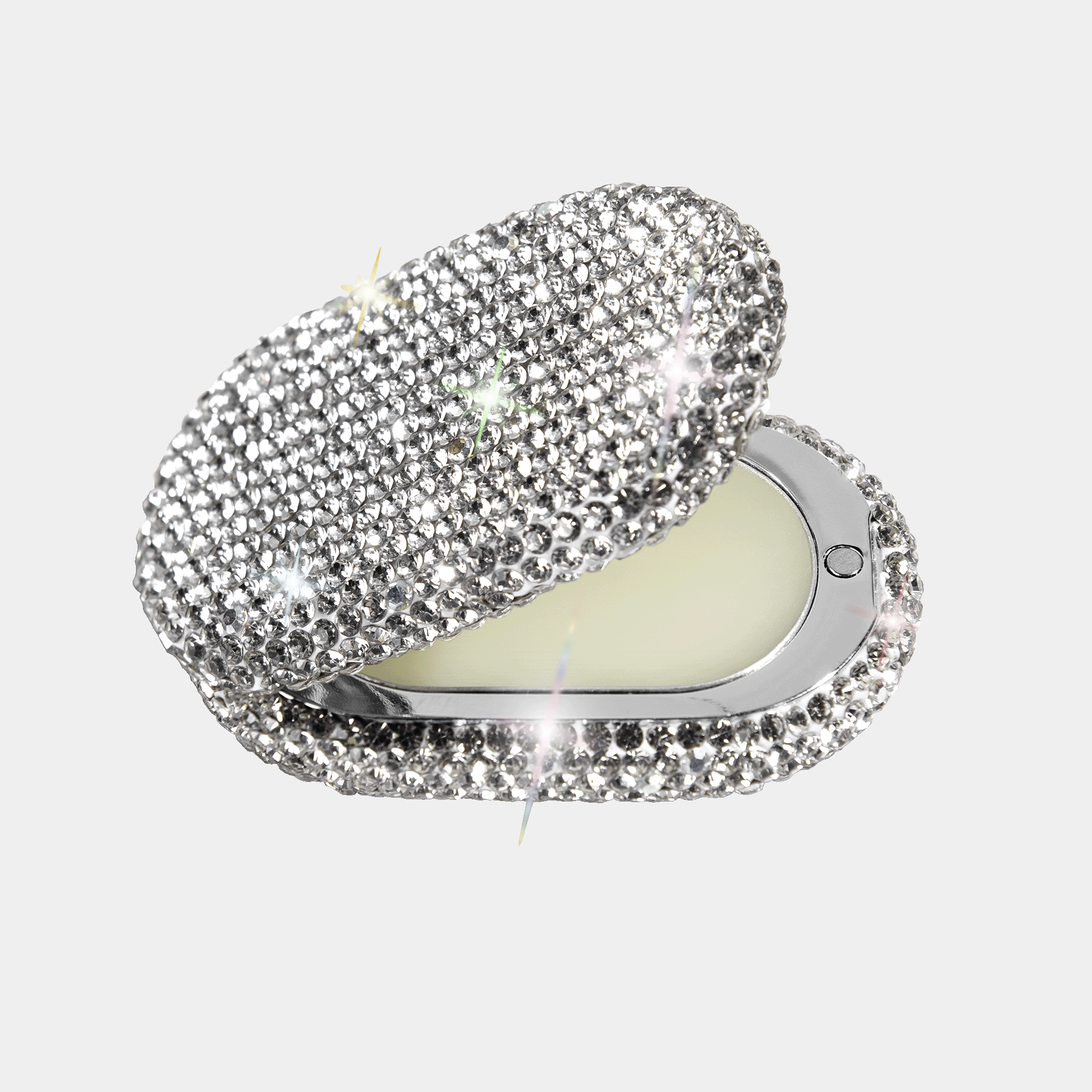 crystal case opened with solid perfume in it