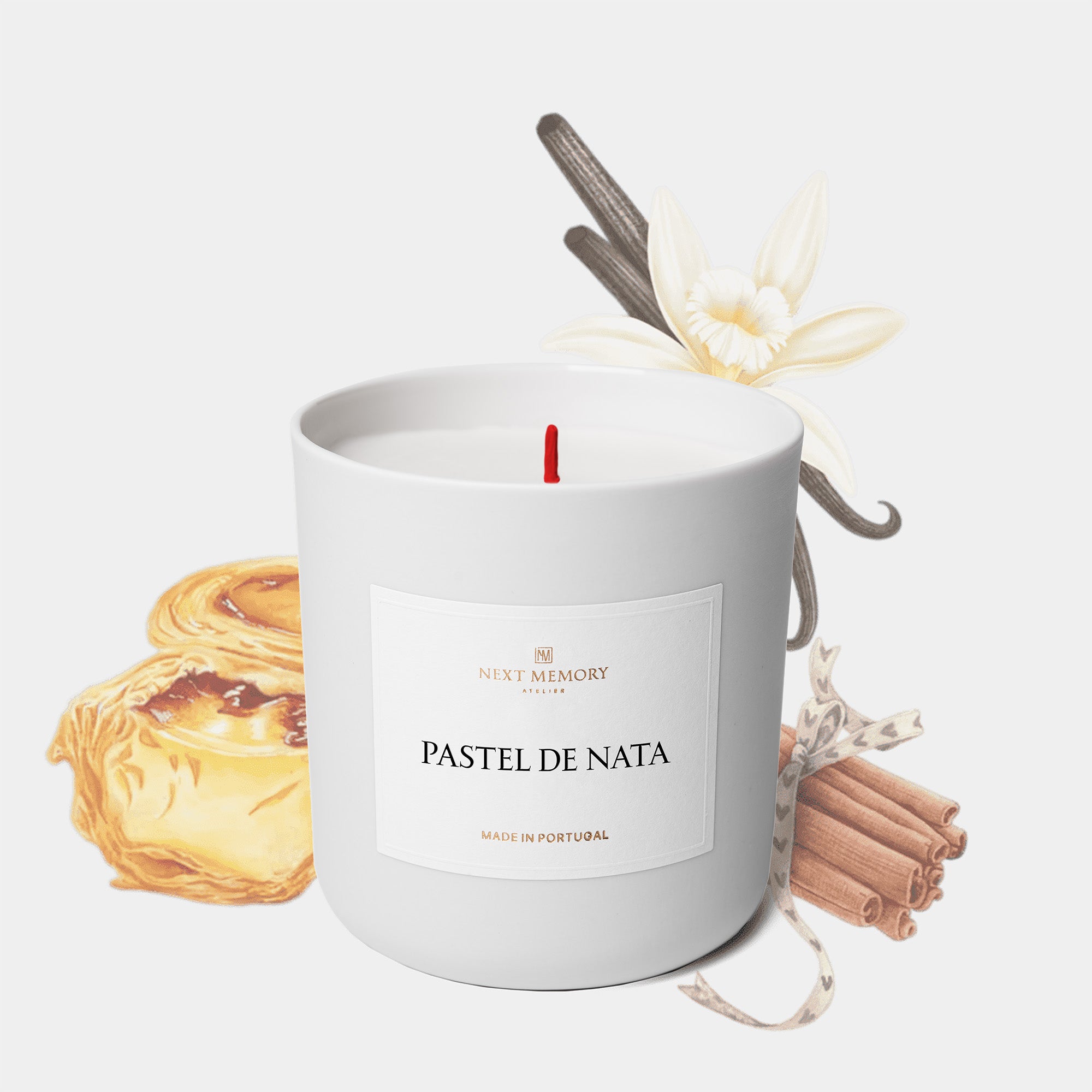 pastel de nata candle with pastel de nata, cinnamon stick and vanilla pod in background