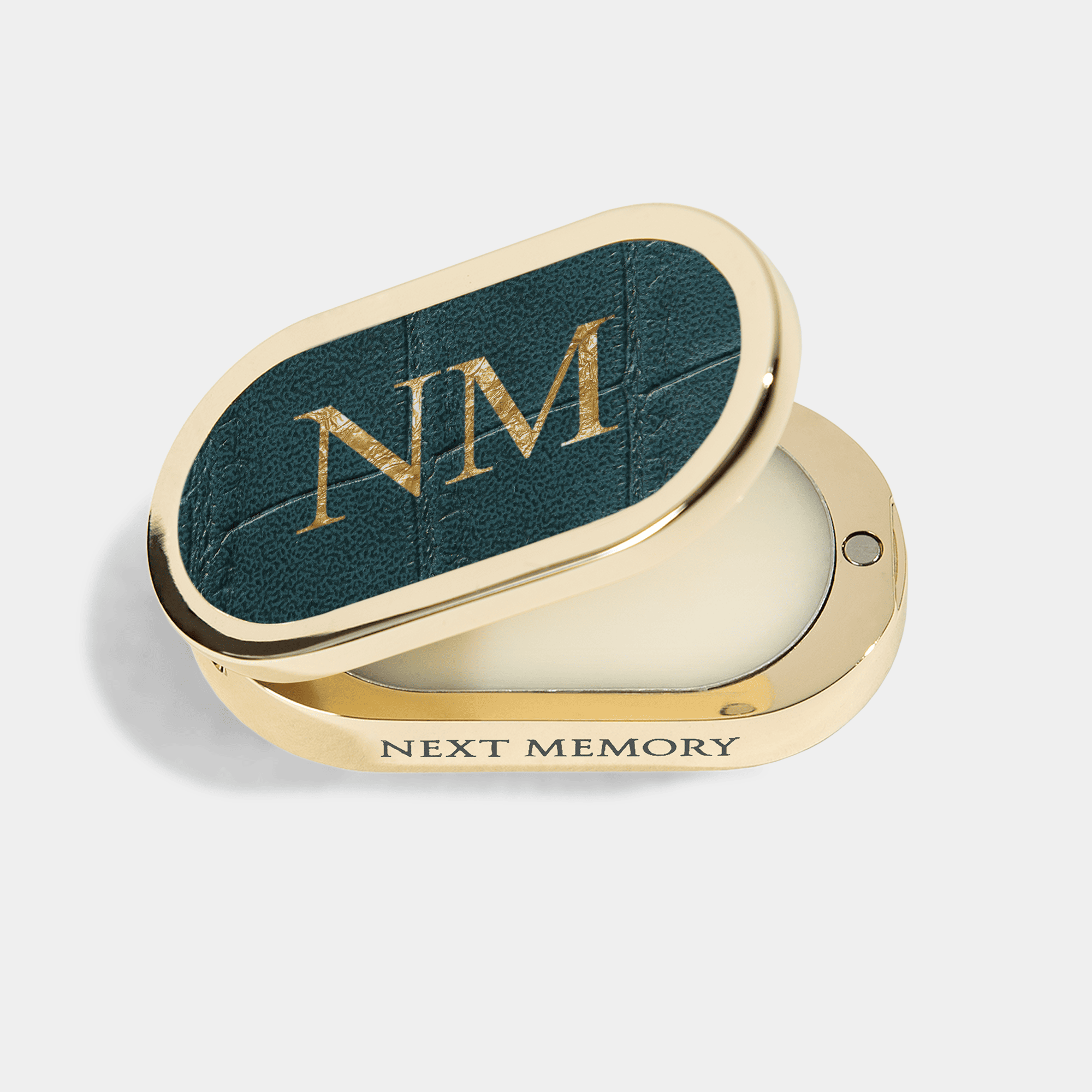 opened shiny gold case with solid perfume inside