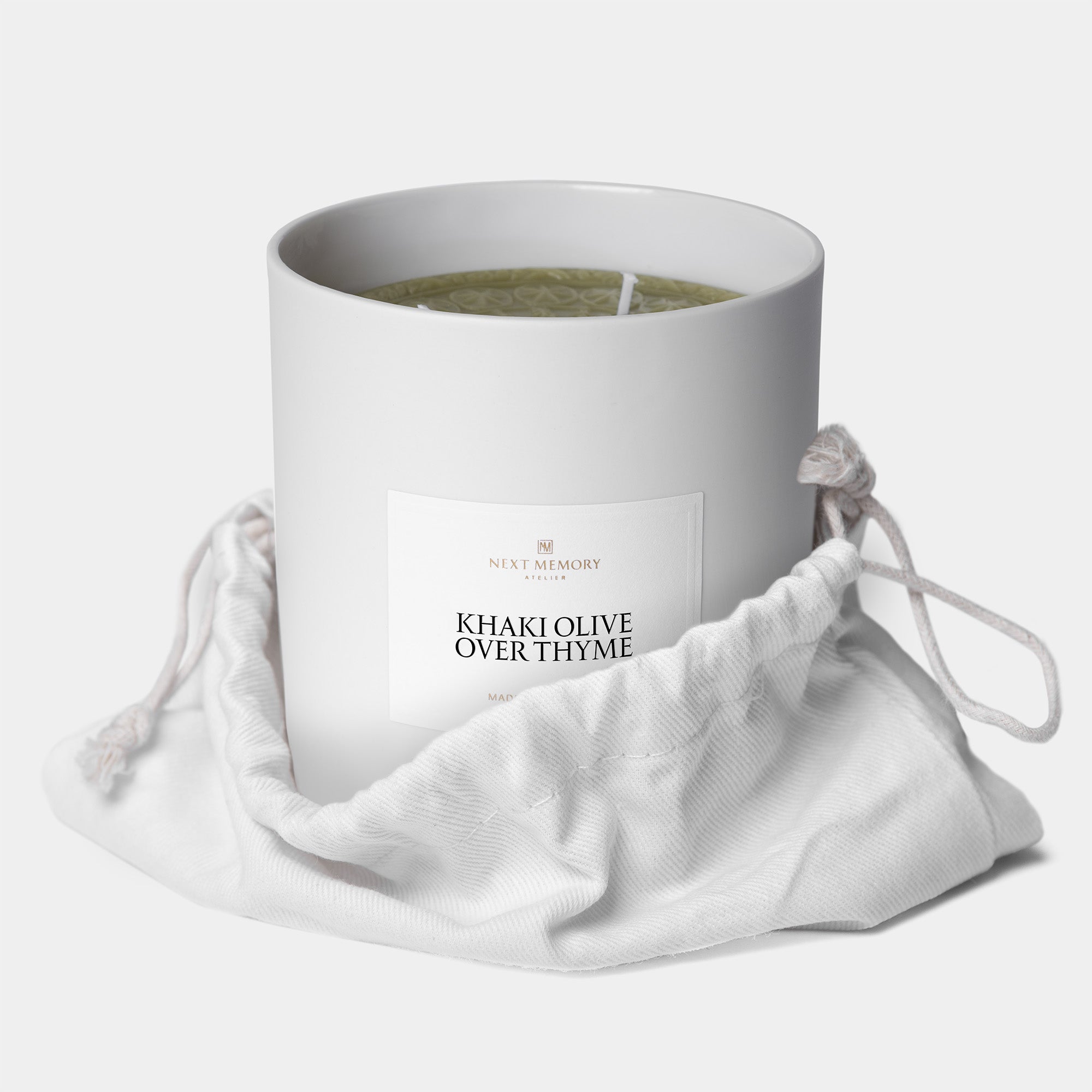 khaki olive over thyme grand medallion candle in a bag