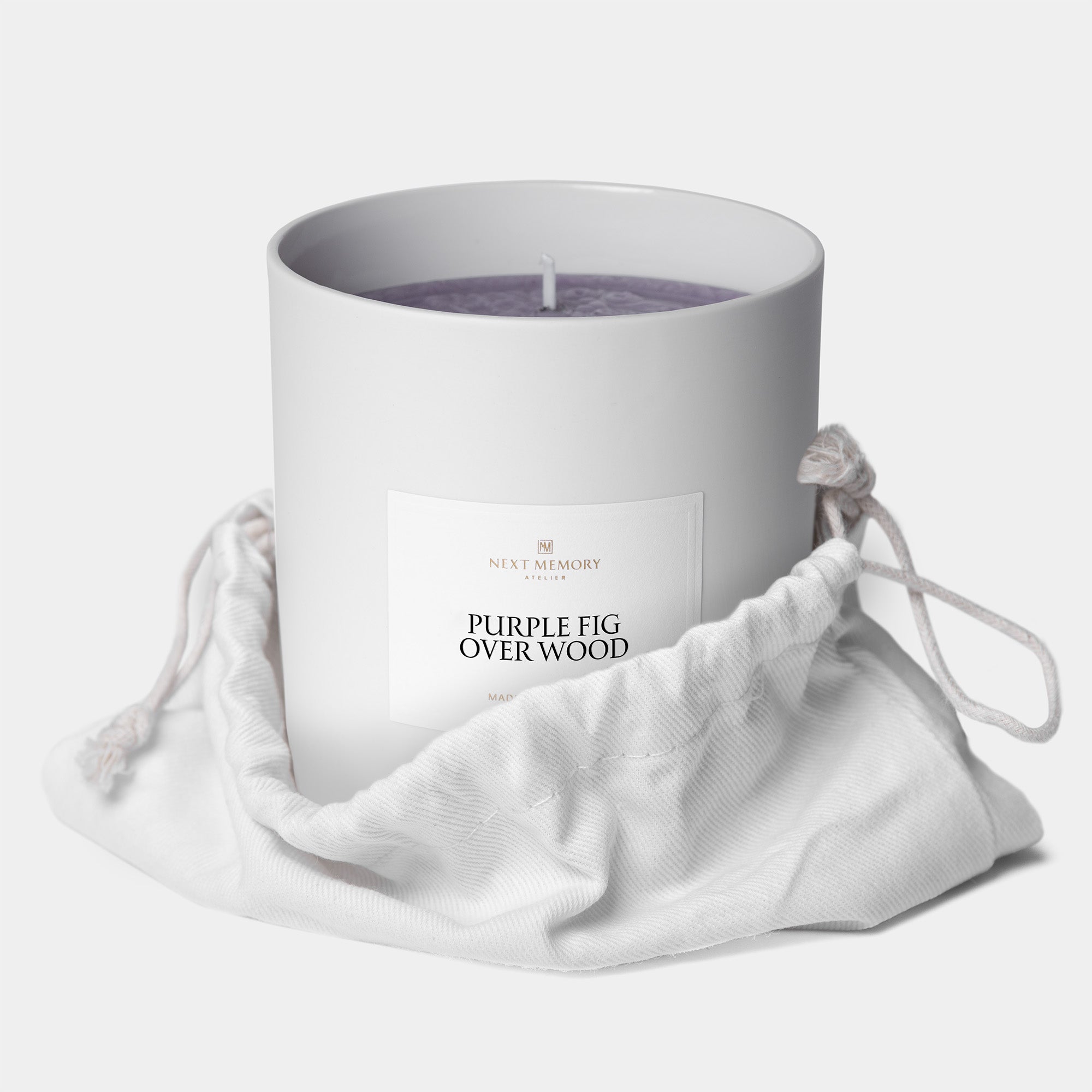 purple fig over wood grand medallion candle in a bag